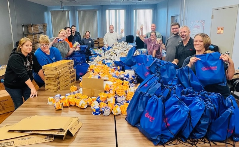 Boomerang Backpacks volunteers filling bags