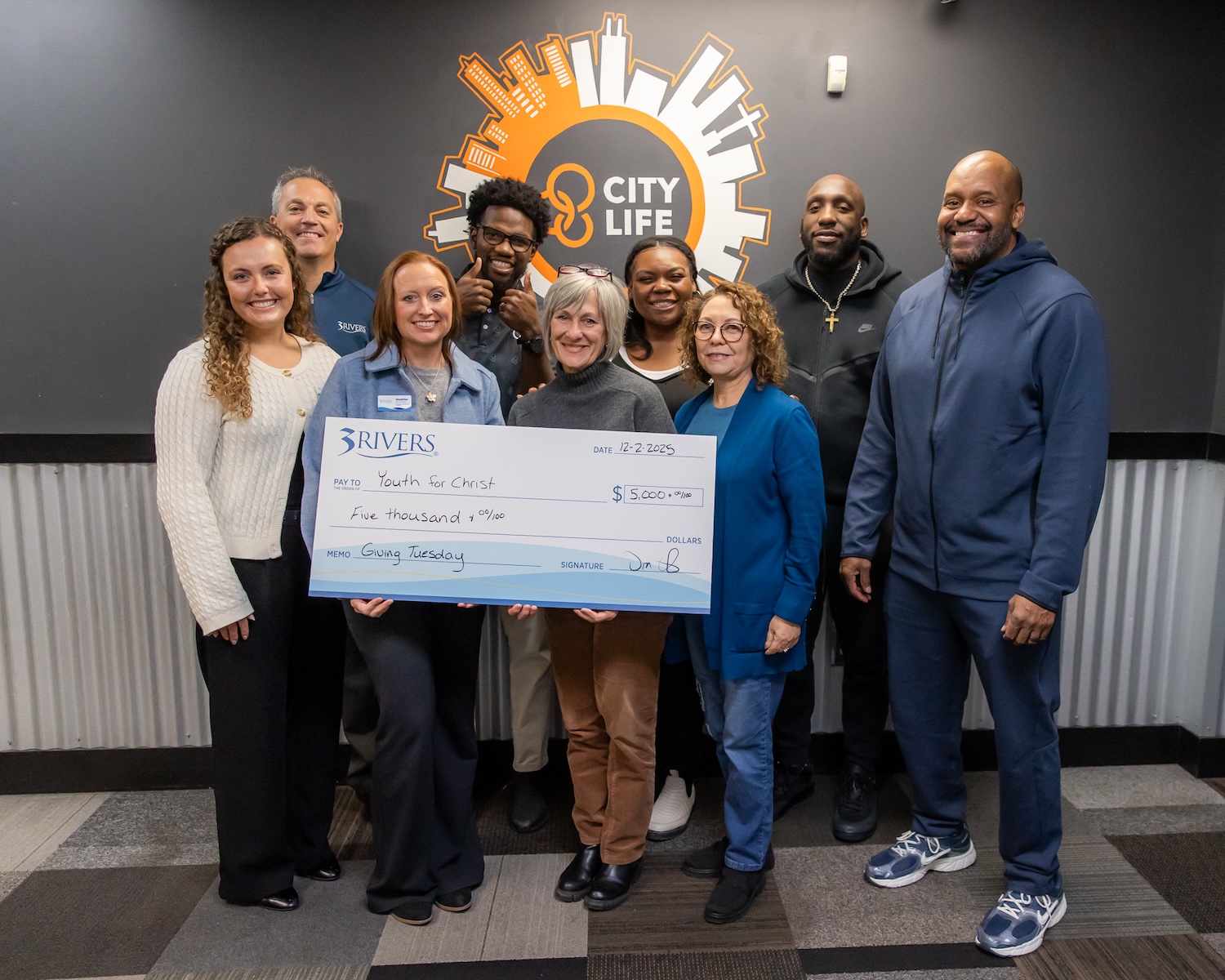 3Rivers presenting a check to City Life